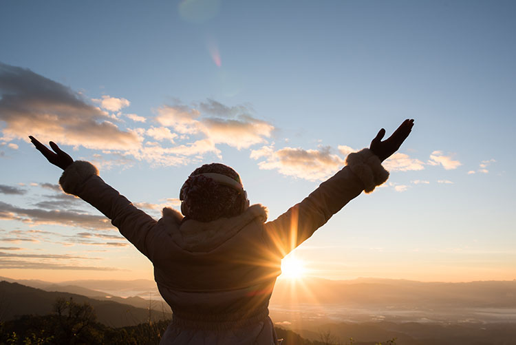 A person manifesting positivity and welcoming new opportunities.