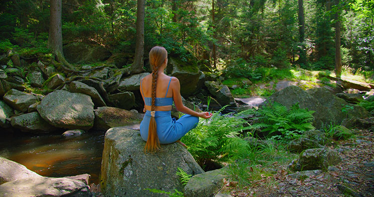 Outdoor meditation promoting chakra balancing for emotional stability.